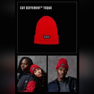 SPENCER BADU red wool knit beanie features a large Cut Different (CD) woven patc